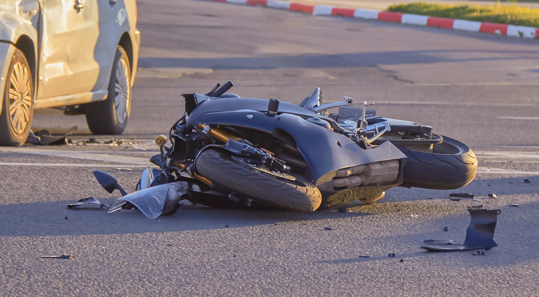motorcycle lying on the ground after a crash